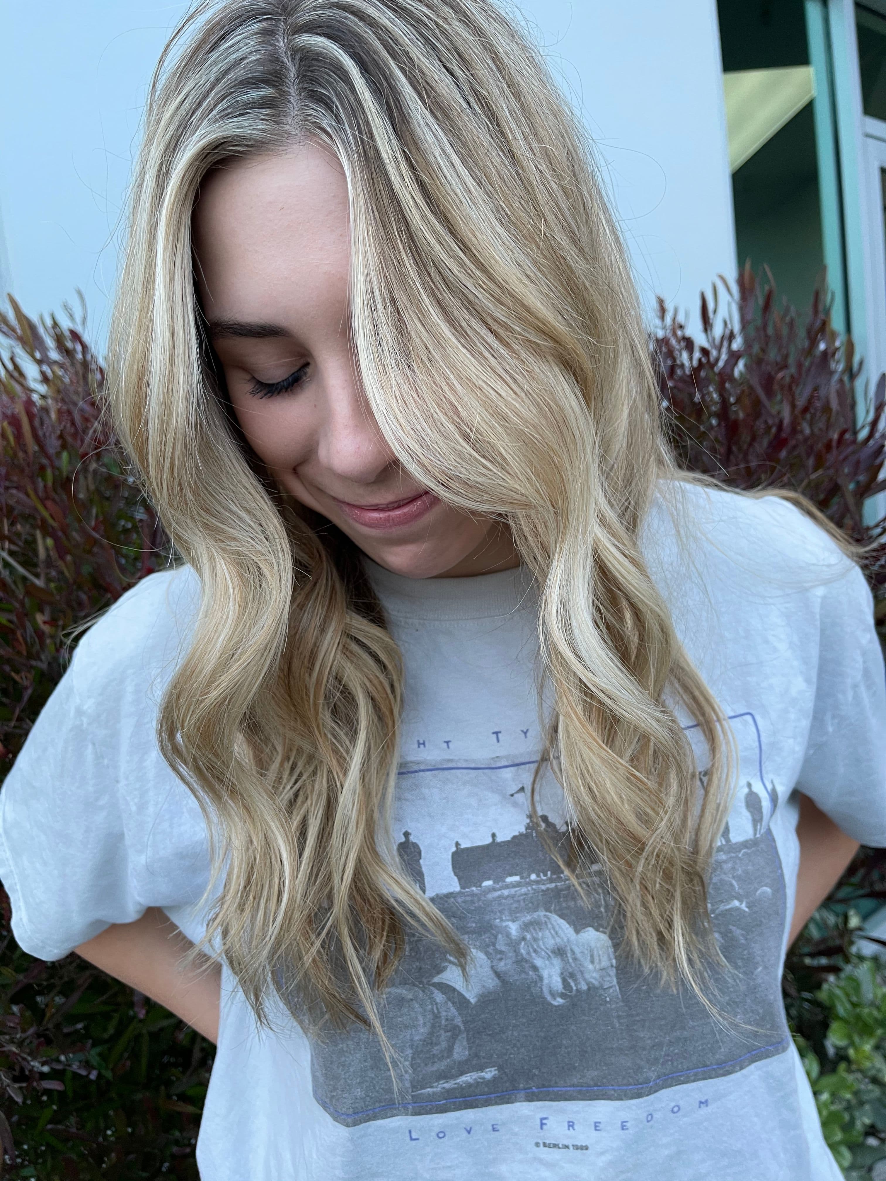 Long blonde wavy hair with natural sun-kissed highlights