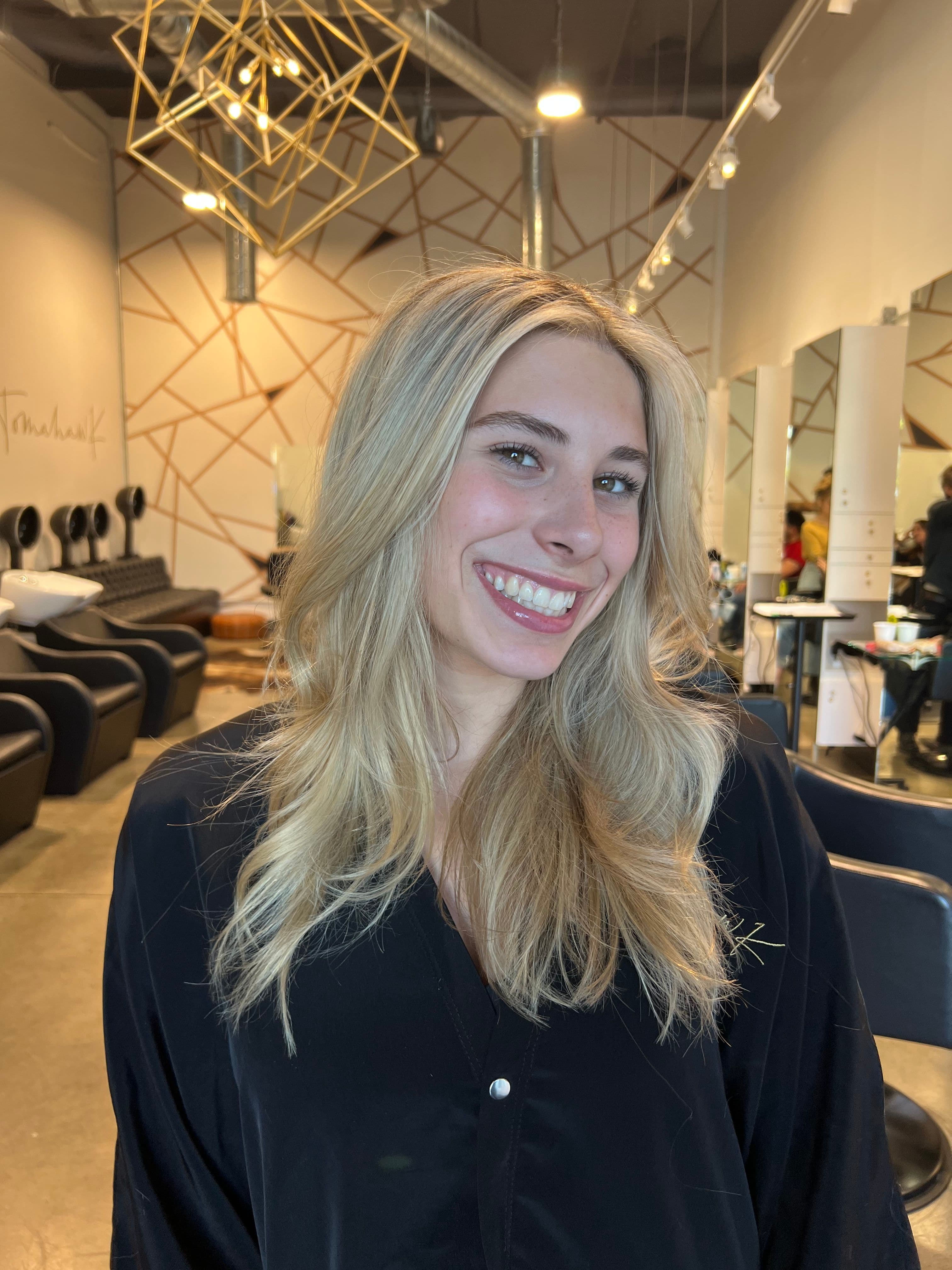 Bright blonde with face-framing layers and volume