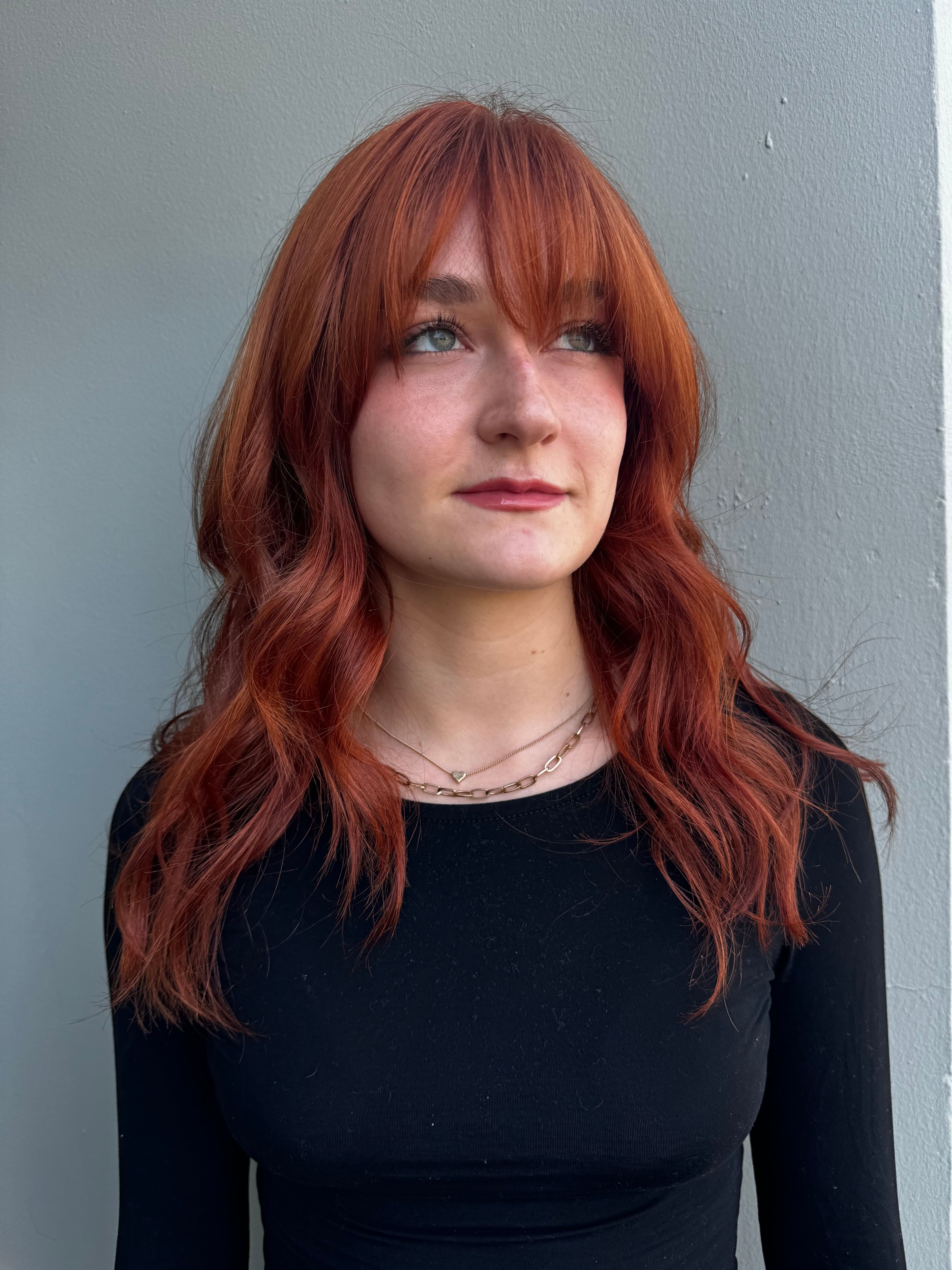 Rich copper red hair color with soft waves