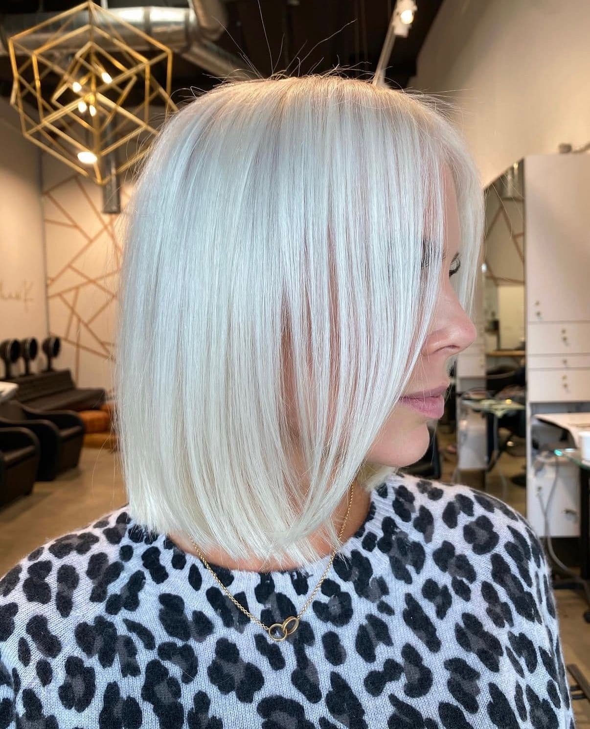 Sleek icy platinum blonde bob with soft layers