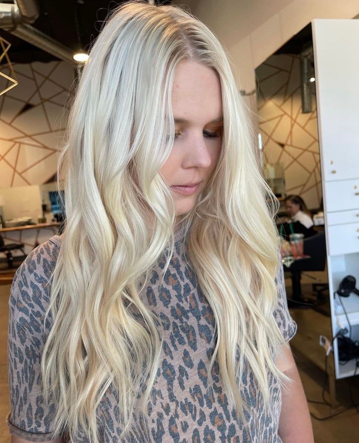 Long platinum blonde hair with loose waves